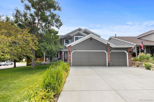 6772 Tiger Tooth, Littleton, CO 80124 - craftsman-style home featuring an attached garage, concrete driveway, a front yard, and brick siding