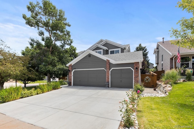 6772 Tiger Tooth, Littleton, CO 80124 - view of front facade featuring a garage, driveway, and brick siding
