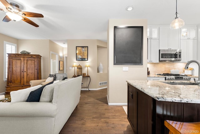 6772 Tiger Tooth, Littleton, CO 80124 - living room featuring dark wood-style flooring, ceiling fan, and recessed lighting