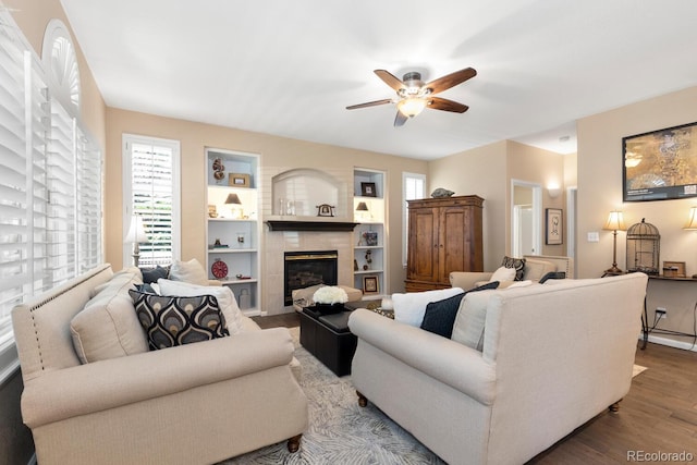 6772 Tiger Tooth, Littleton, CO 80124 - living area featuring wood finished floors, a ceiling fan, and plenty of natural light