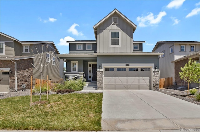 24555 E Ohio Dr, Aurora, CO 80018 - view of front of house featuring board and batten siding, a porch, concrete driveway, a garage, and stone siding