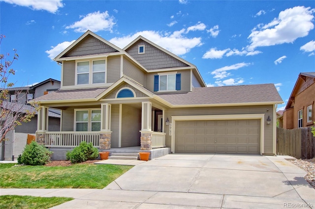 5947 Cumbre Vista Way, Colorado Springs, CO 80924 - craftsman house featuring a porch, concrete driveway, and a garage
