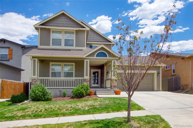 5947 Cumbre Vista Way, Colorado Springs, CO 80924 - craftsman inspired home with a porch, driveway, a garage, and stone siding