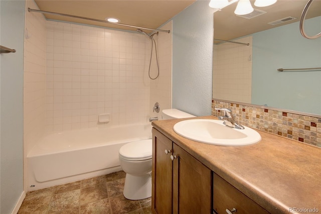 5947 Cumbre Vista Way, Colorado Springs, CO 80924 - bathroom with vanity, backsplash, bathtub / shower combination, stone finish floors, and recessed lighting