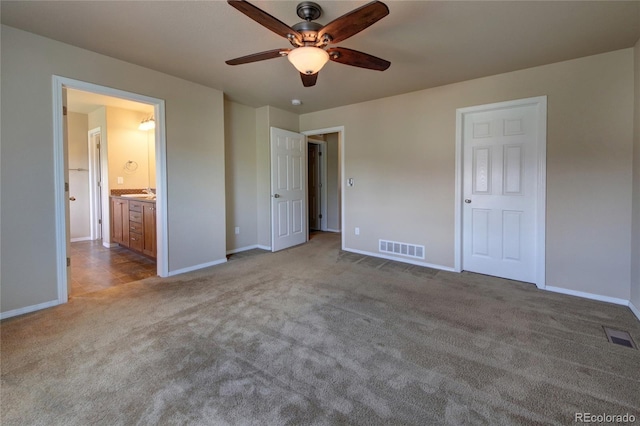 5947 Cumbre Vista Way, Colorado Springs, CO 80924 - unfurnished bedroom featuring carpet, ensuite bathroom, and ceiling fan