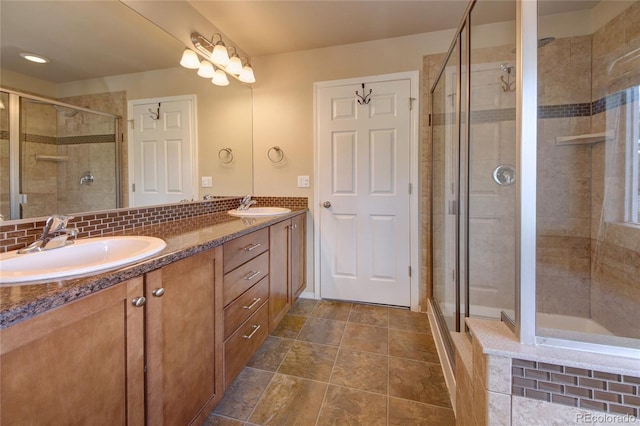5947 Cumbre Vista Way, Colorado Springs, CO 80924 - bathroom featuring double vanity and a shower stall