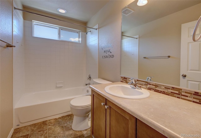 5947 Cumbre Vista Way, Colorado Springs, CO 80924 - bathroom featuring vanity, bathtub / shower combination, and tasteful backsplash