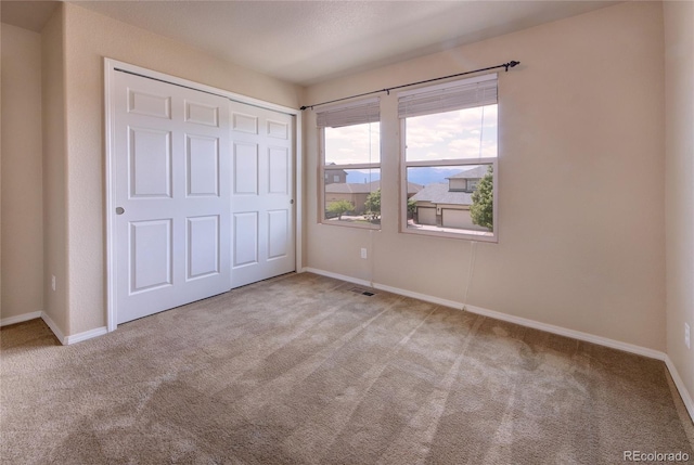 5947 Cumbre Vista Way, Colorado Springs, CO 80924 - unfurnished bedroom featuring carpet flooring and a closet