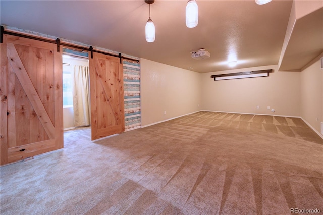 5947 Cumbre Vista Way, Colorado Springs, CO 80924 - below grade area with carpet floors and a barn door