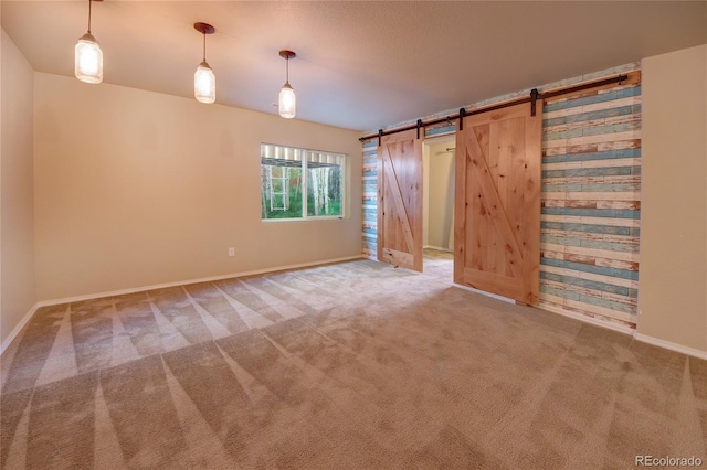 5947 Cumbre Vista Way, Colorado Springs, CO 80924 - unfurnished bedroom featuring carpet and a barn door