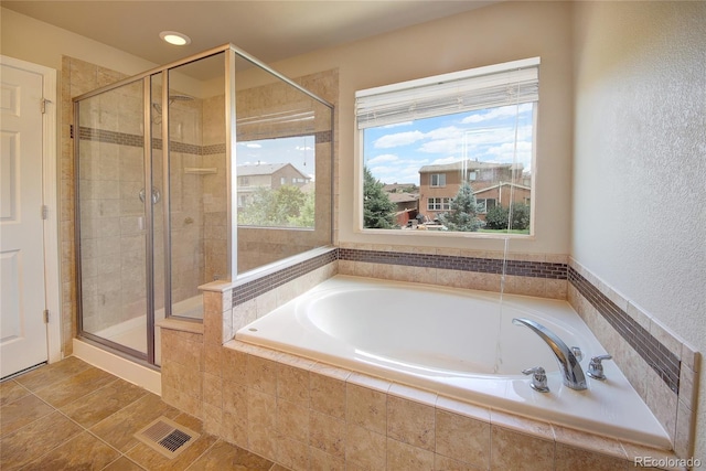 5947 Cumbre Vista Way, Colorado Springs, CO 80924 - bathroom featuring a garden tub, a shower stall, recessed lighting, and a textured wall