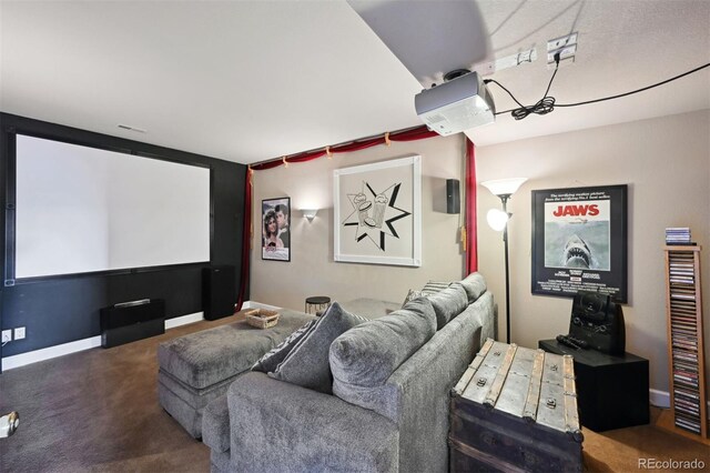 home theater with carpet floors and baseboards