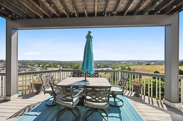 deck with outdoor dining area