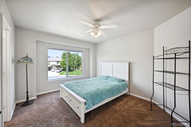 bedroom with carpet floors, baseboards, and a ceiling fan