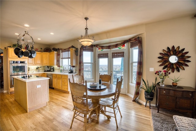 dining space featuring recessed lighting, french doors, light wood-style flooring, and baseboards