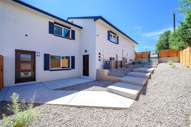 4901 W 11th Ave, Denver, CO 80204 - back of property featuring brick siding and a patio area