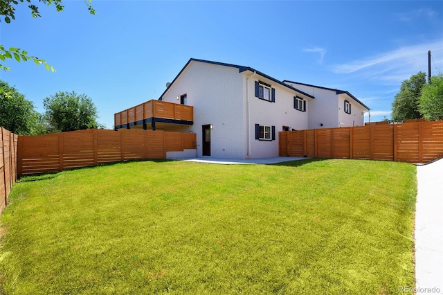 4901 W 11th Ave, Denver, CO 80204 - back of house featuring a fenced backyard and a patio
