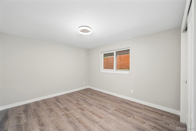 4901 W 11th Ave, Denver, CO 80204 - unfurnished room featuring wood finished floors and baseboards
