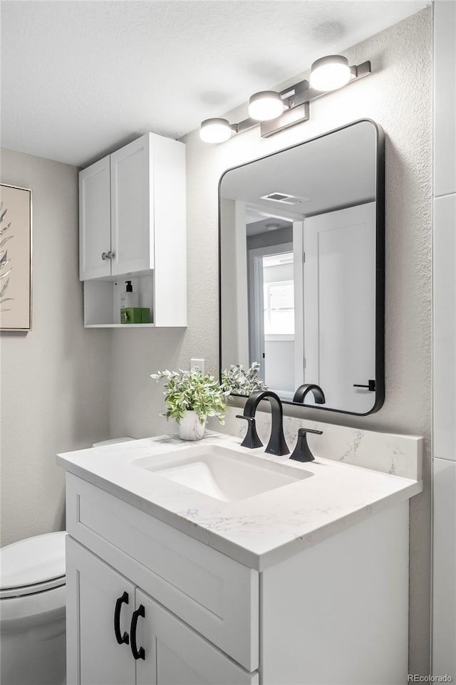 4901 W 11th Ave, Denver, CO 80204 - bathroom featuring vanity and toilet