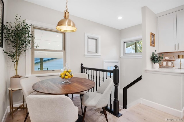 dining room with light hardwood / wood-style flooring