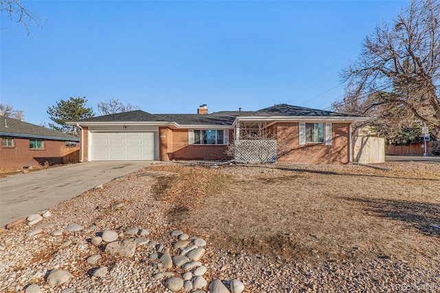 single story home with brick siding, fence, concrete driveway, a chimney, and a garage