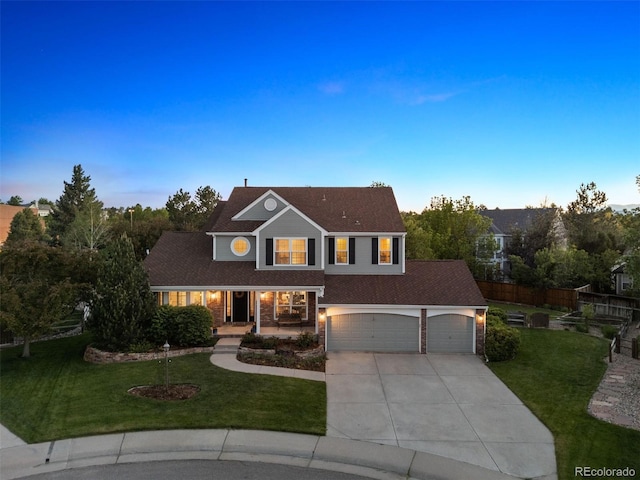 3566 E Meadow Creek Pl, Highlands Ranch, CO 80126 - traditional-style home with driveway, covered porch, and an attached garage