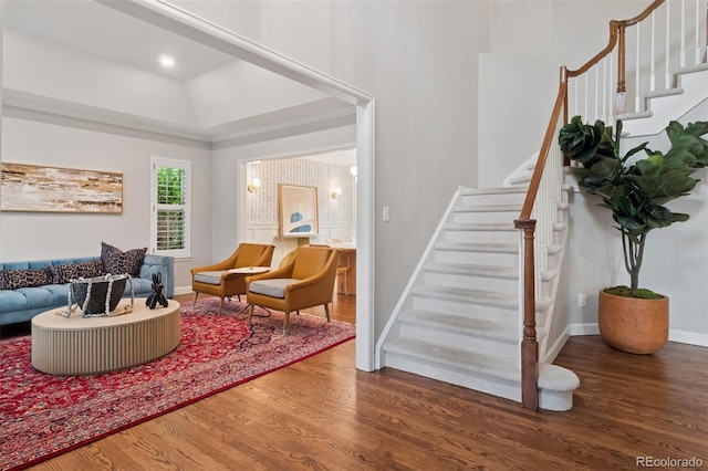 3566 E Meadow Creek Pl, Highlands Ranch, CO 80126 - living area featuring wood finished floors, stairs, baseboards, and a raised ceiling