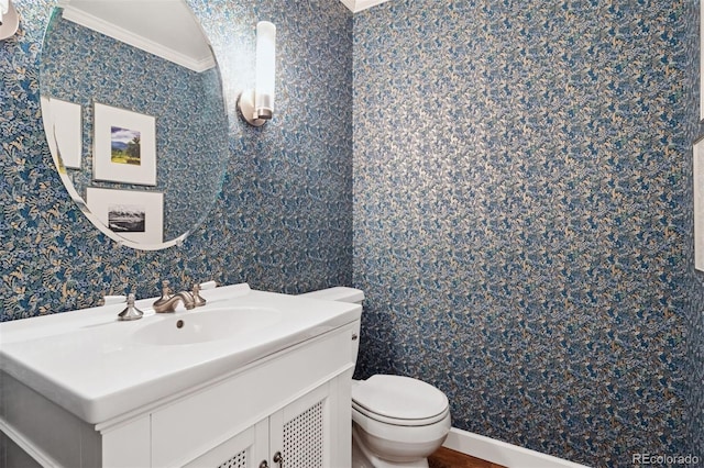 3566 E Meadow Creek Pl, Highlands Ranch, CO 80126 - bathroom featuring wallpapered walls, toilet, vanity, and ornamental molding