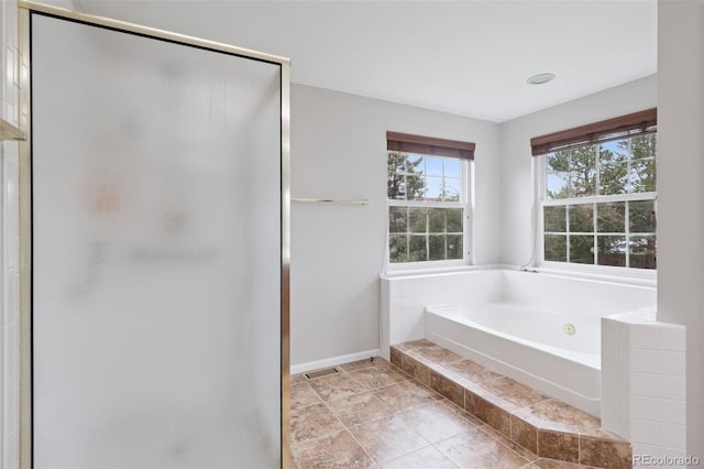 3566 E Meadow Creek Pl, Highlands Ranch, CO 80126 - full bath featuring a shower stall, a bath, and baseboards