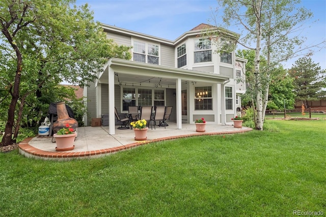 3566 E Meadow Creek Pl, Highlands Ranch, CO 80126 - rear view of house with a patio area