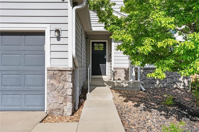 doorway to property with stone siding