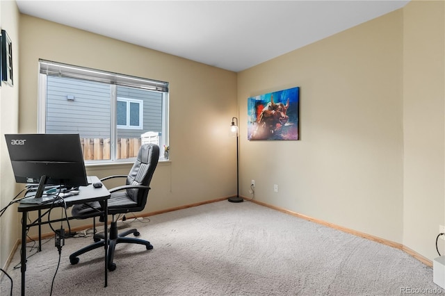 unfurnished office with carpet and baseboards