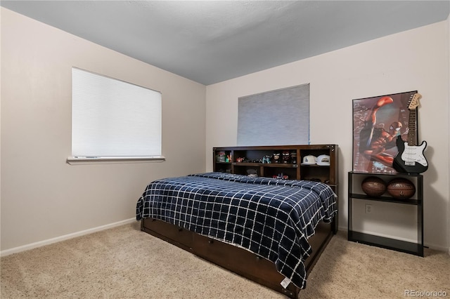 carpeted bedroom with baseboards