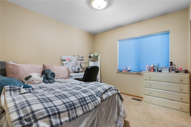 carpeted bedroom with baseboards