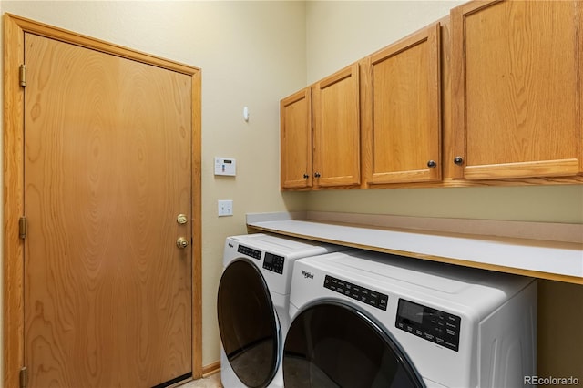 laundry room featuring cabinet space and washer and dryer