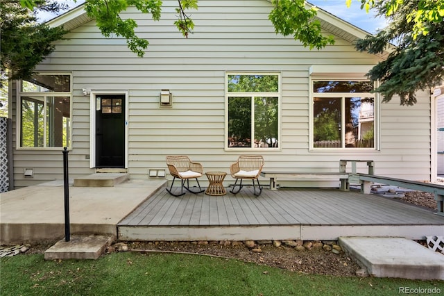 rear view of house featuring a deck