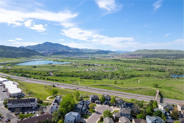 aerial perspective of suburban area with a water and mountain view