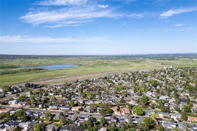 aerial view of residential area featuring a nearby body of water