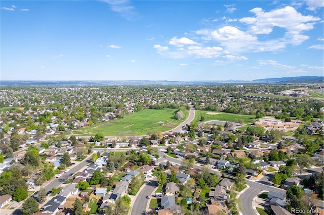 aerial view of property's location featuring nearby suburban area and mountains