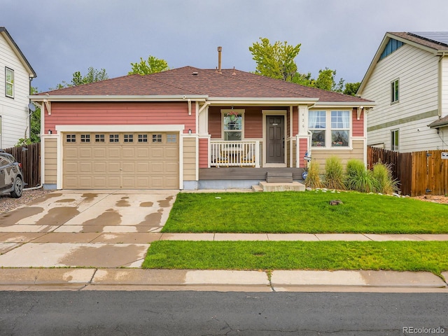 426 N 48th Ave, Brighton, CO 80601 - view of front of property with covered porch, concrete driveway, an attached garage, and a shingled roof