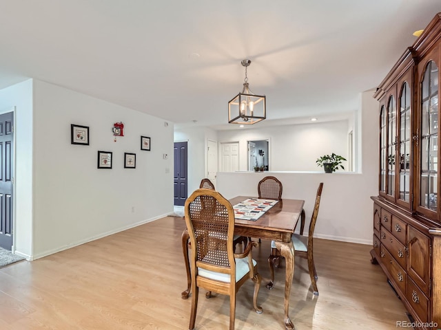 426 N 48th Ave, Brighton, CO 80601 - dining room featuring light wood-type flooring, a chandelier, and recessed lighting