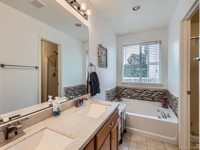 426 N 48th Ave, Brighton, CO 80601 - full bath with a stall shower, a bath, double vanity, and tile patterned floors