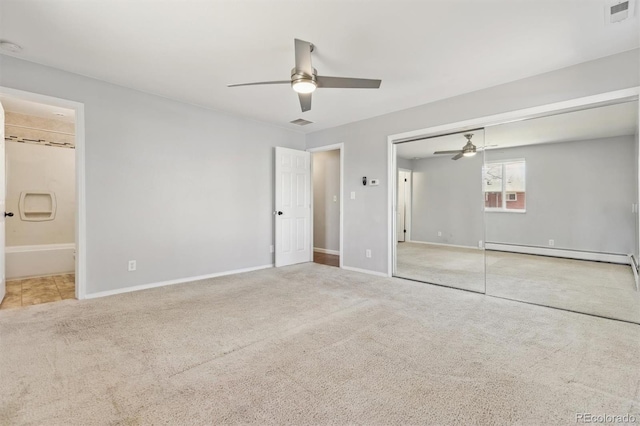 unfurnished bedroom featuring a ceiling fan, visible vents, a closet, a baseboard heating unit, and carpet flooring