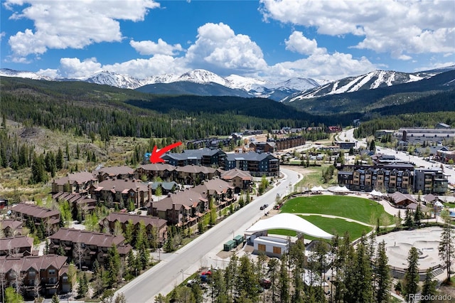 301 Trailhead Cir Unit 324, Winter Park, CO 80482 - aerial view of a mountainous background and a heavily wooded area