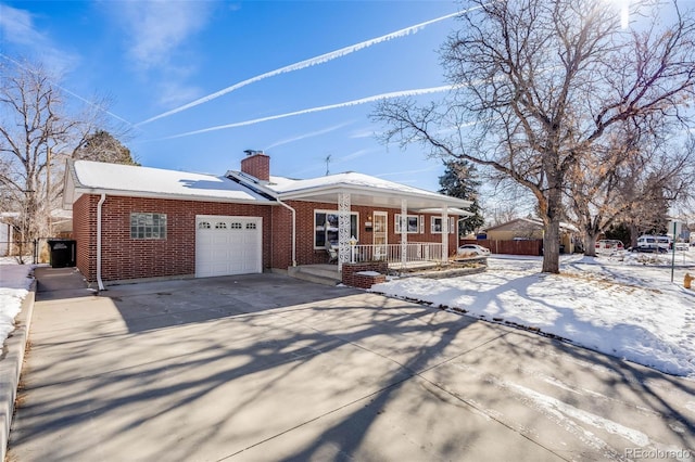 view of front of house with a garage and a porch