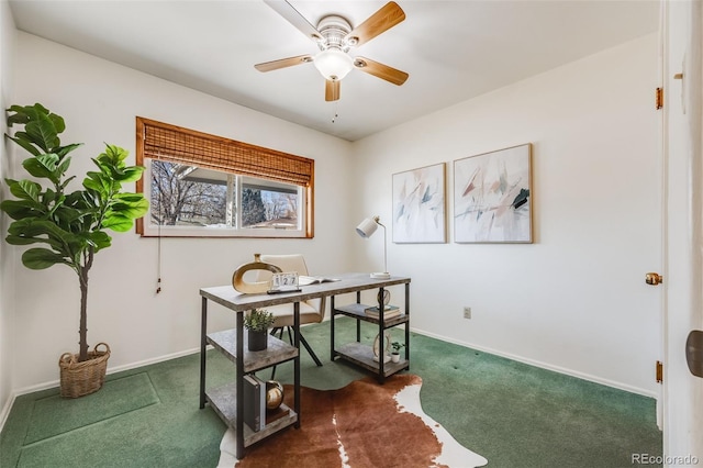 home office featuring ceiling fan and dark carpet