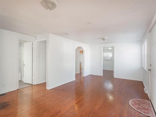 spare room with wood-type flooring