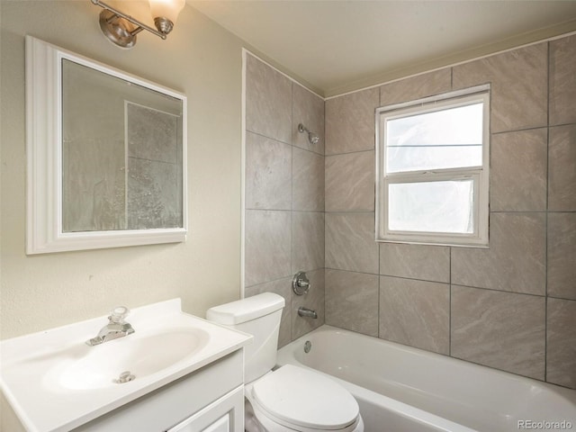 full bathroom with vanity, toilet, and tiled shower / bath