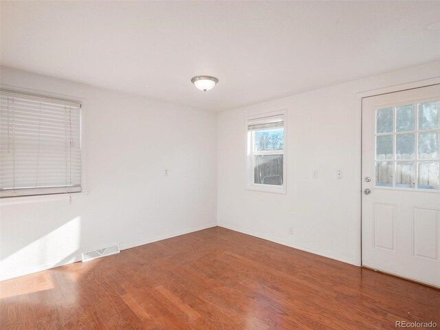 empty room featuring wood-type flooring