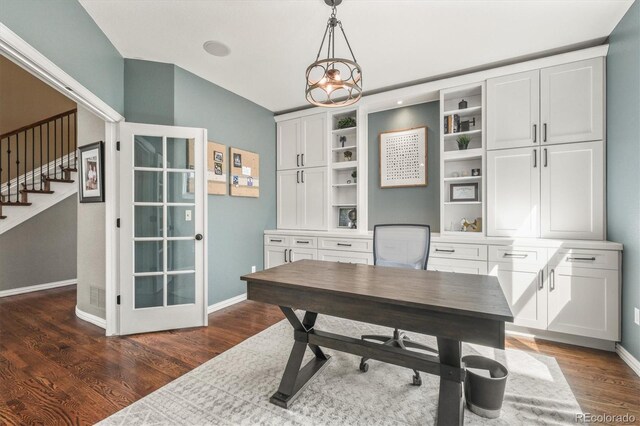 office space with baseboards and dark wood-style floors